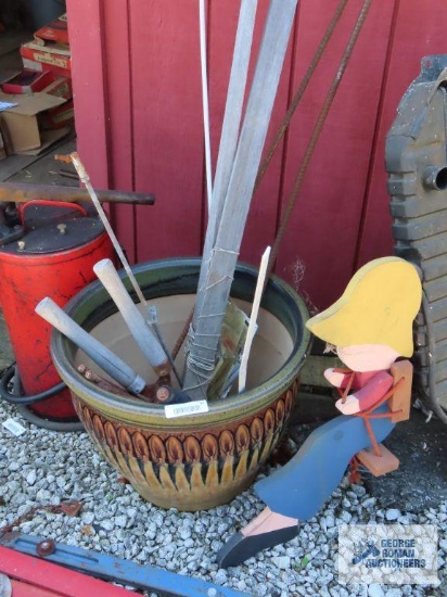 Decorative clay planter, wooden yard decoration. rebar cutoffs