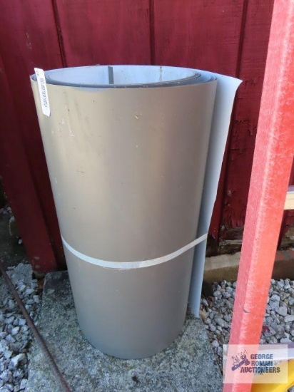 Partial roll of aluminum trim.