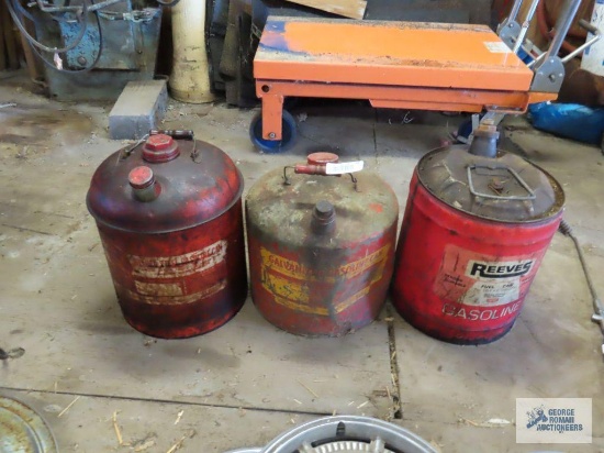 Three metal gas cans