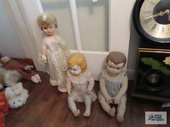 Boy and girl ceramic doll figurines approximately 12" tall. Bride doll with stand.