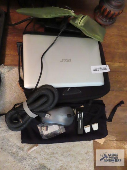 Small Acer laptop with accessories