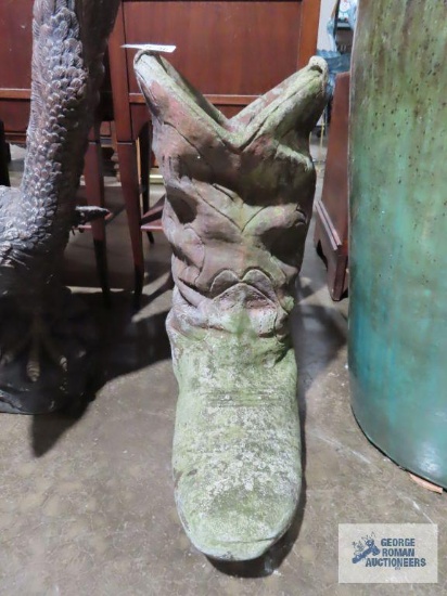 Heavy concrete cowboy boot planter. Has crack in it