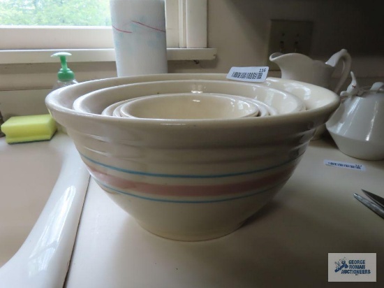 Five mixed oven ware bowls. One is marked McCoy and others only marked oven proof