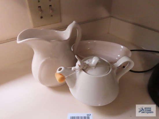 Three pieces of pottery, including an unmarked pitcher, Pfaltzgraff serving bowl and a three-piece