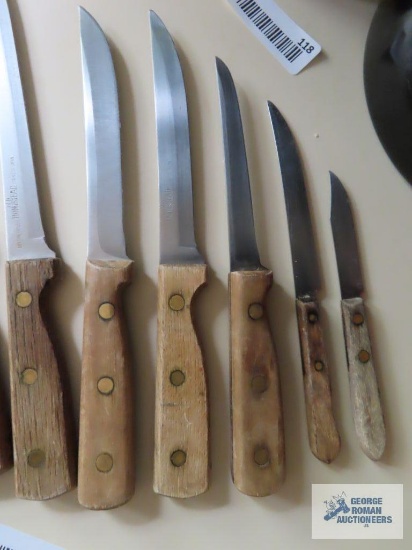 10 piece wood handled knife set. Some marked Old Homestead Lifetime Cutlery.