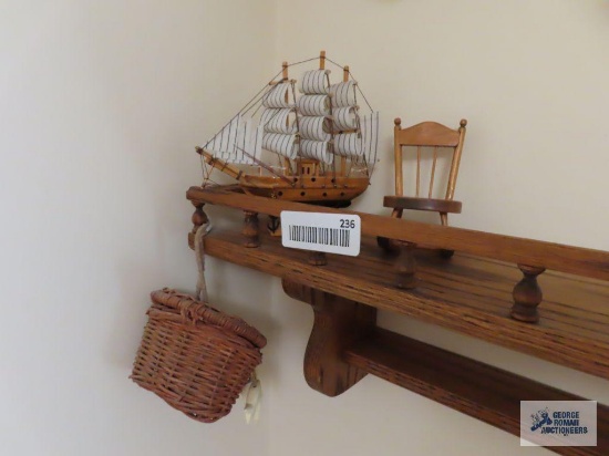 Miniature wooden ship replica and rocking chair. Hanging basket. Does not include wall mounting.