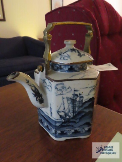 Oriental teapot with metal handle