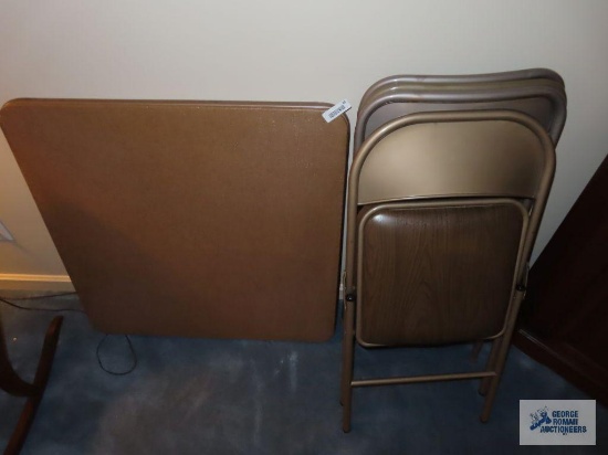 Card table and four chairs on first floor.
