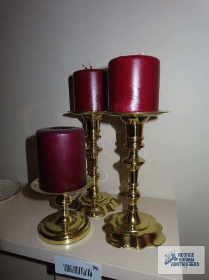 Three Baldwin brass candle holders with candles