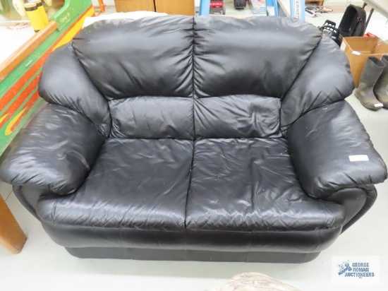 Black faux leather sofa, loveseat, chair, and power recliner. Recliner includes blue cover.