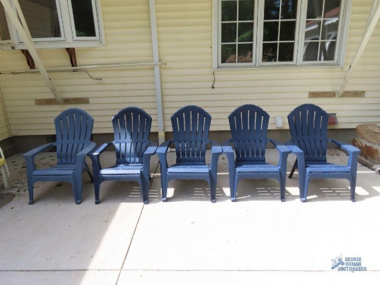 Five plastic outdoor chairs
