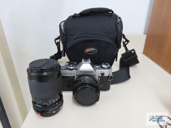 Canon AE-1 camera with extra lens and bag