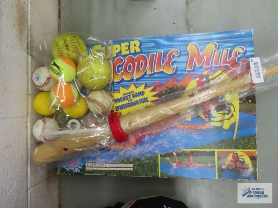 Baseball bat with baseballs and slip and slide