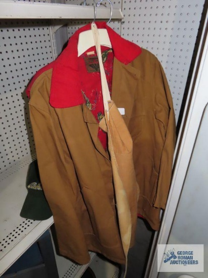 Two jackets, caps, and carpenter apron. The tan jacket is size 44. No size for the other jacket.