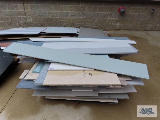 Assorted marble, laminate, and granite countertop pieces
