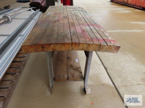 Workshop bench with wooden top. 5' 4" long x 2' 2" wide x 2' 8" tall