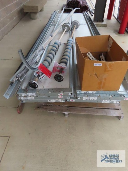 Commercial garage door. 12' 1" wide x 12' tall. Door may be missing some hardware.