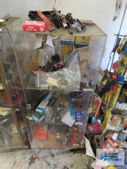 Display with assorted hardware and automotive parts