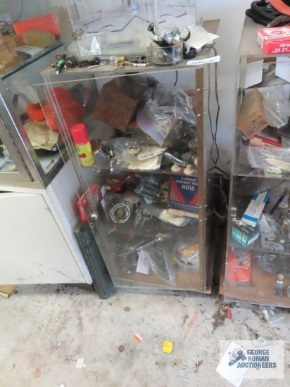 Display with assorted hardware and automotive parts