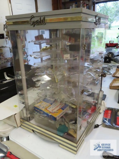 Speidel watch display with various New Old Stock and used automotive parts