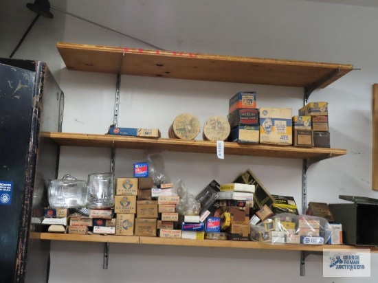Assorted automotive bulbs and assorted items on shelves