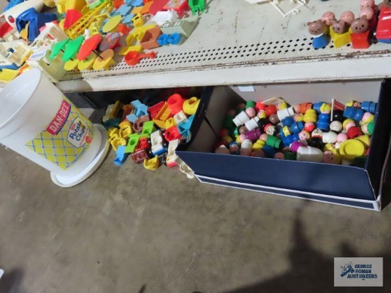 Variety of little people figurines and cars, chairs, beds