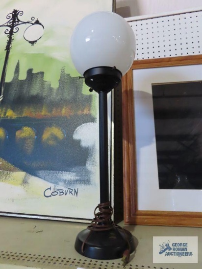Lamp with round glass globe