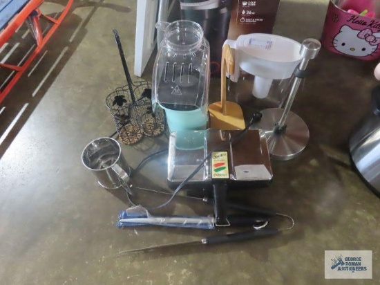 Popcorn maker, pizza maker, Brita water filter, banana hanger, paper towel holder, and sifter