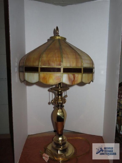 Brass lamp with tan plastic stained glass shade, lamp is approximately 27", shade is 11"x 15".