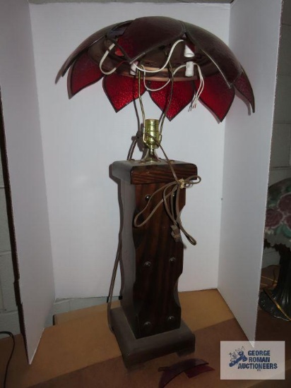Wooden base lamp with unattached glass flower shade, one petal is broken, lamp is 31", shade is 18".