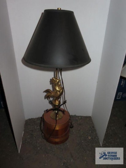 Wooden basket with brass rooster weather vane lamp and black lamp shade, approximately 30".