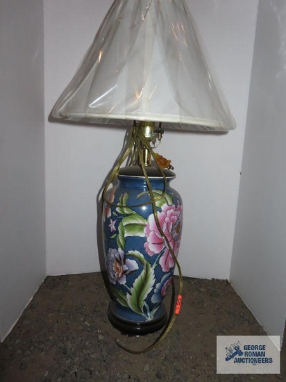 Blue floral ceramic lamp with white shade, approximately 27".