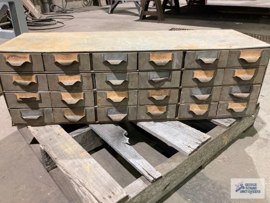 Columbia Marking Tools hand stamping inserts with cabinet.