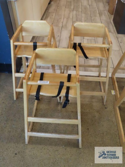 Three wooden high chairs