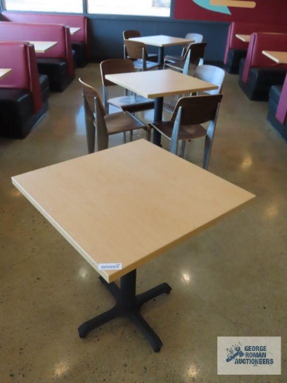 Three 2' 4" x 2' 4" tables with formica tops and eight modern chairs