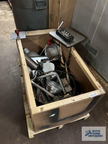 assorted kitchen utensils and supplies with wooden crate.