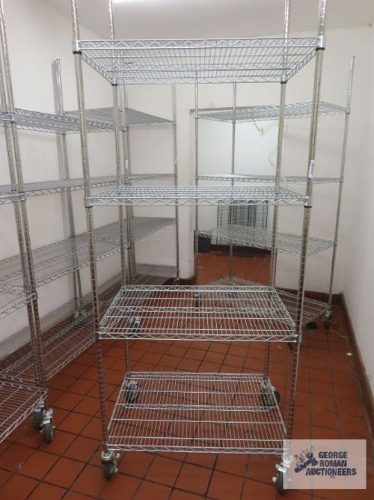 Stainless steel roll about adjustable rack made by Olympic Storage Products. 3' x 2' x 7' 8". Rack