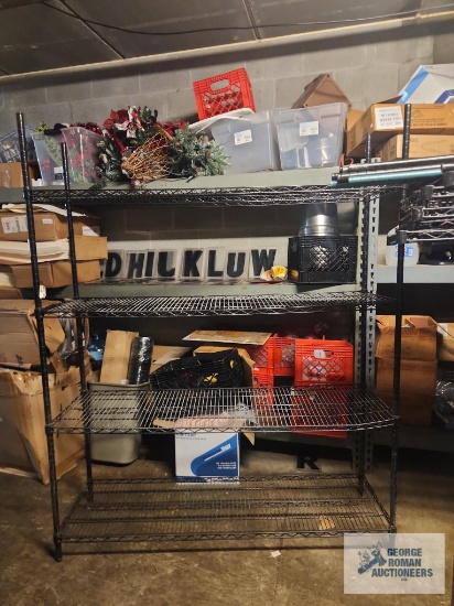 Black adjustable metal shelving unit. 5'x18"