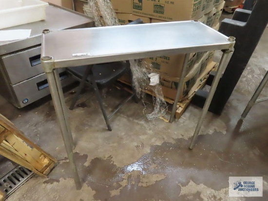 Stainless steel top with legs.