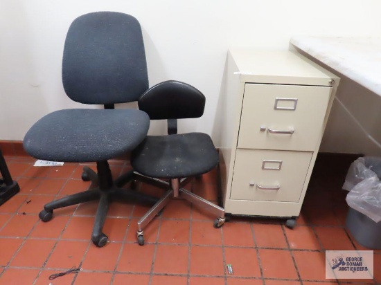 Roll about two drawer metal filing cabinet, two office chairs, and flat screen TV stand