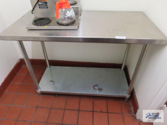 Stainless steel table. 4' x 2' x 34-1/2".
