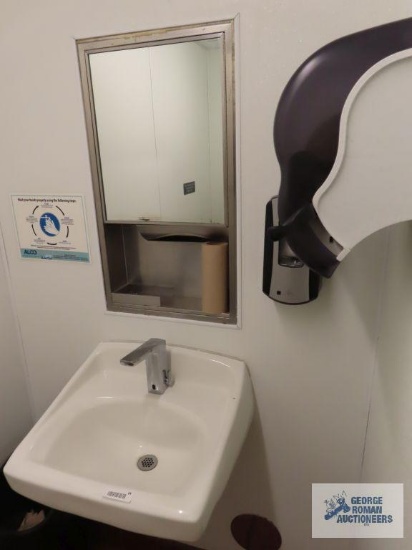 Bathroom sink with soap dispenser, paper towel holder, seat protector holder, tissue paper holder,