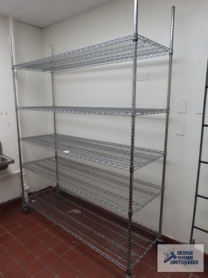 Commercial roll about stainless steel adjustable rack made by Olympic Storage Products. 6' x 2' x 7'