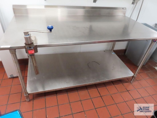 Stainless steel table with Edland manual can opener. 6' x 3' x 36".