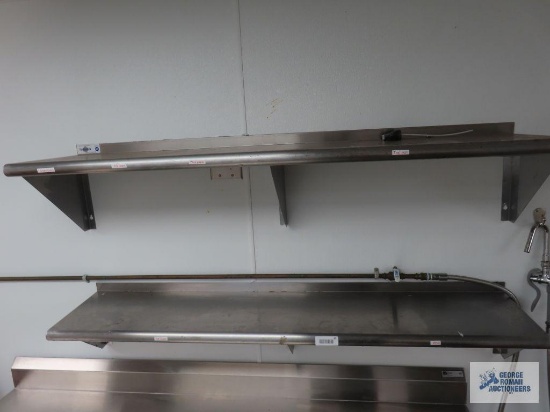 Two stainless steel wall shelves. 5' x 12". Buyer to remove from wall.