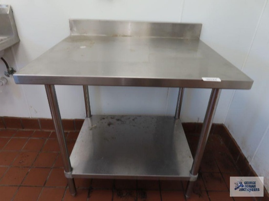 Stainless steel table. 3' x 30" x 35".