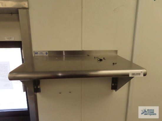 Two stainless steel wall shelves. 2' x 14" and 3' x 12". Buyer to remove from wall.