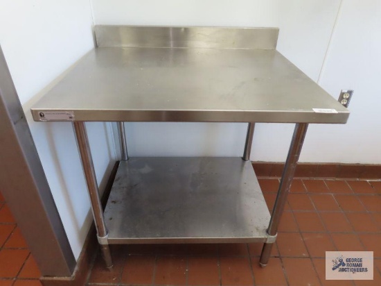 Stainless steel table. 3' x 30" x 35".