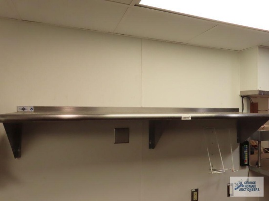 Two stainless steel wall shelves. 6' x 14" and 2' x 14". Buyer to remove from wall.
