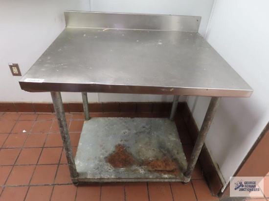 Stainless steel table. 3' x 30" x 33-1/2".